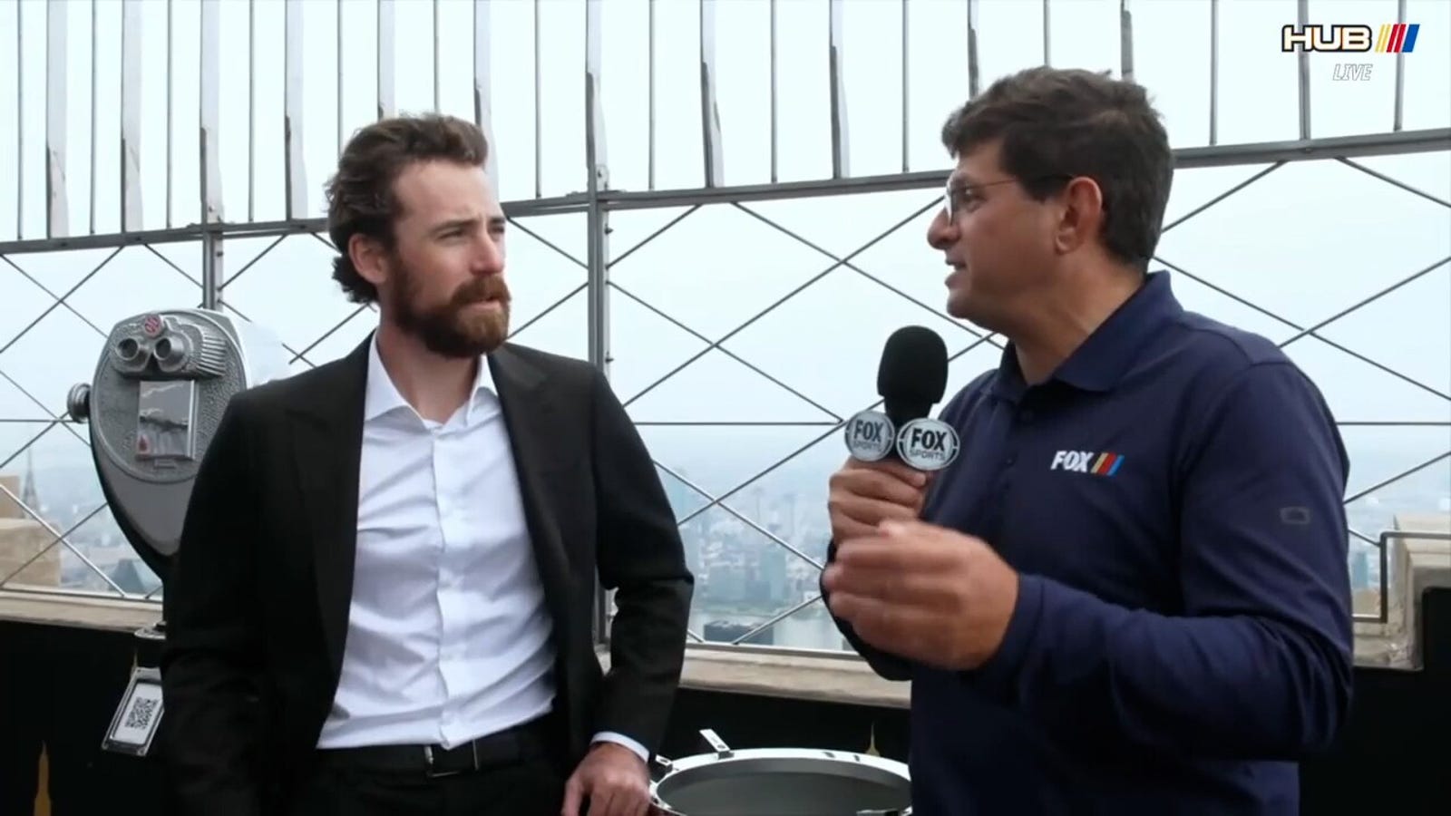 Ryan Blaney talks with Bob Pockrass on top of the Empire State Building after winning the 2023 Cup title